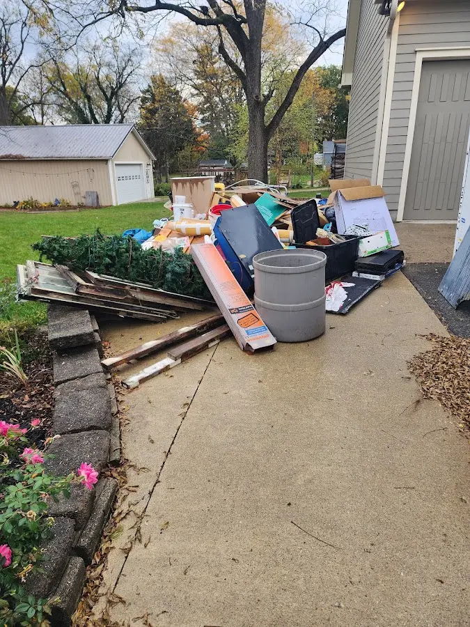 Dumpster being loaded with debris for Commercial Dumpster Rental in Windsor